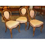Three matching Victorian walnut parlour chairs,