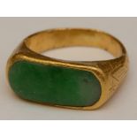 A 24ct gold and jade ring,
