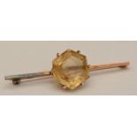 A 9ct gold citrine bar brooch, the central hexagonal cut citrine within claw setting,