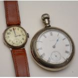 A silver cased trench watch, the white enamel dial with Arabic numerals and subsidiary seconds dial,