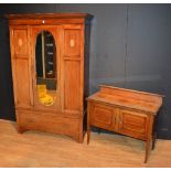 An Edwardian inlaid wardrobe with matching washstand,