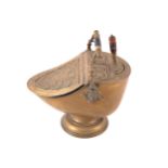 Nineteenth-century brass coal helmet with embossed paterae decorated lid, a scroll handle and