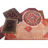 Six Persian rugs five rugs, one runner  200 x 115 cm.; 73 x 50 cm.;106 x 75cm.; 86 cm. diameter;