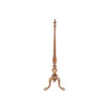 Edwardian walnut and parcel gilt standard lamp with a reeded baluster stem, supported on a scroll