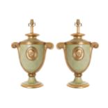 Pair of parcel gilt and veined marbled urn stemmed table lamps  45 cm. high; 35 cm. wideWorldwide