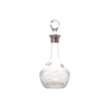 Silver mounted crystal claret decanter complete with stopper  30 cm. high; 15 cm.