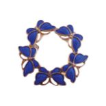 Silver and cobalt blue enamel brooch with a circle of butterflies