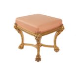 REGENCY PERIOD CARVED GILT WOOD AND UPHOLSTERED STOOL the square upholstered seat, above a gadrooned