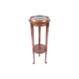 NAPOLEON III ORMOLU MOUNTED MAHOGANY TWO TIER TORCHÈRE the circular marble inset top, below a