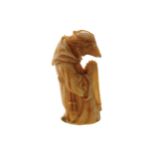 CARVED MINIATURE FIGURE of a anthropomorphic tonsured monk holding a rosary beads 6.5 cm. high
