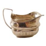 IRISH GEORGE III PERIOD BRIGHT CUT DECORATED CRESTED SILVER CREAM JUG Dublin 1806. Maker: Richard