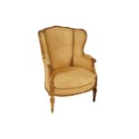 NINETEENTH-CENTURY CARVED GILT FRAMED AND UPHOLSTERED WING ARM CHAIR, CIRCA 1870 with loose