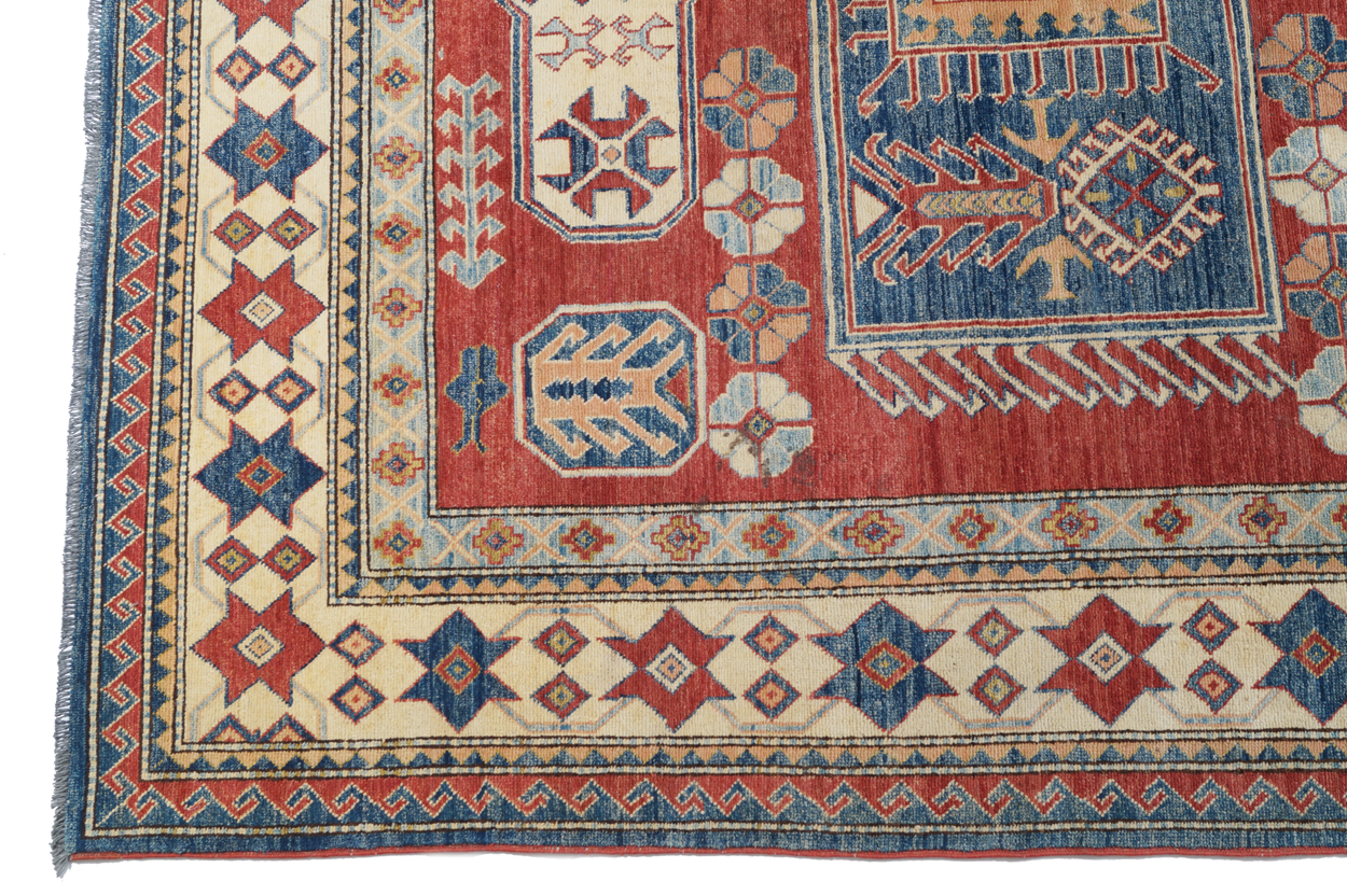 KAZAKH CAUCASIAN CARPET with ivory border and two rectangular blue medallions 327 x 236 cm. - Image 2 of 6