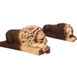 PAIR OF NINETEENTH-CENTURY CAST IRON RECUMBENT LIONS each raised on a square base Provenance: