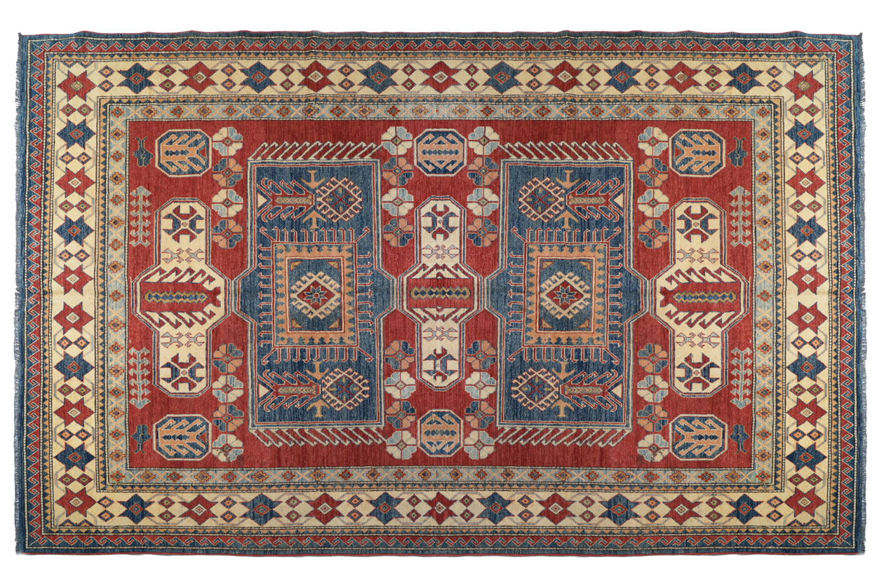 KAZAKH CAUCASIAN CARPET with ivory border and two rectangular blue medallions 327 x 236 cm.