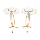 PAIR OF ART NOUVEAU BRONZE TABLES each with a oval glass top, raised on a tri-part stem and scroll