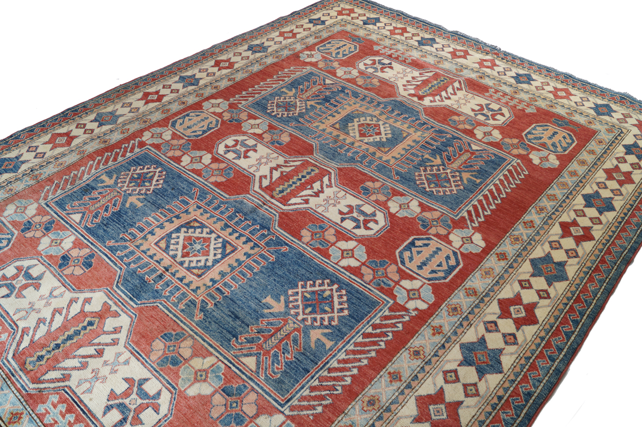 KAZAKH CAUCASIAN CARPET with ivory border and two rectangular blue medallions 327 x 236 cm. - Image 3 of 6