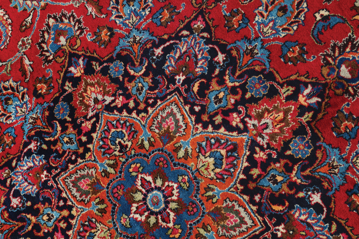 NORTHEAST PERSIAN CARPET on rich red ground with navy border; includes weaver’s signature 402 x - Image 2 of 9