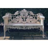 HEAVY CAST IRON LEAF DECORATED GARDEN BENCHES with canine mounted scroll ends 95 cm. high; 150 cm.