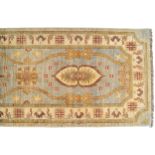 NORTHWEST PERSIAN RUNNER on turquoise ground with medallions and ivory border 384 x 80 cm. Worldwide
