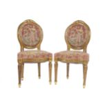 PAIR OF NINETEENTH-CENTURY CARVED GILTWOOD FRAMED SIDE CHAIRS each with floral carved oval backs and