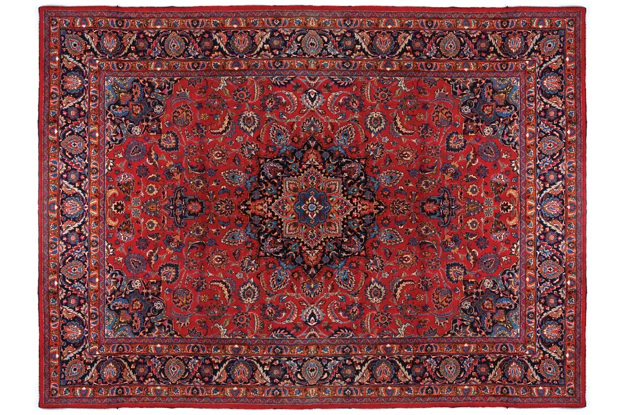 NORTHEAST PERSIAN CARPET on rich red ground with navy border; includes weaver’s signature 402 x