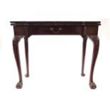 GEORGE II PERIOD RED WALNUT FOLD-OVER GAMES TABLE, CIRCA 1760 the rectangular top with square