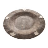 LIBERTY STYLE HAMMERED METAL PLATE with raised elephant decoration. Signed 30.5 cm. diameter