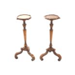 PAIR OF NINETEENTH-CENTURY WALNUT TORCHÈRES each with a square serpentine shaped top, raised on a