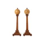 PAIR OF LATE NINETEENTH-CENTURY GLOBES Terrestrial and celestial, each raised on an oak stem 34