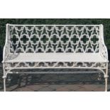 HEAVY CAST IRON GOTHIC TRACERY PANELLED GARDEN BENCH raised on scroll ends, joined by a stretcher