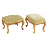 PAIR OF NINETEENTH-CENTURY CARVED GILT WOOD AND UPHOLSTERED STOOLS each with a rectangular