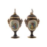 PAIR OF NINETEENTH-CENTURY PARIS PORCELAIN URNS AND COVERS each surmounted by a cherub, with oval