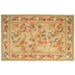 TAPESTRY central medallion with roses and poppies and trailing floral border on beige ground 172 x