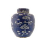 CHINESE QING PERIOD GINGER JAR AND COVER of bulbous form decorated with prunus 25 cm. high; 22 cm.