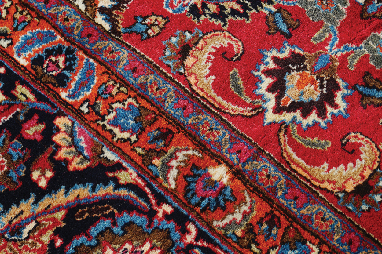 NORTHEAST PERSIAN CARPET on rich red ground with navy border; includes weaver’s signature 402 x - Image 9 of 9