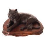 JAPANESE MEIJI PERIOD BRONZE SCULPTURE OF A TIGER Signed. Raised on a hardwood base 10 cm. long