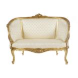 NINETEENTH-CENTURY GILT FRAMED WINDOW SEAT the curvaceous leaf scroll carved panelled upholstered