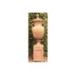 PAIR OF LARGE TERRACOTTA ESTATE URNS WITH LIDS each of vase shape with scroll handles draped with