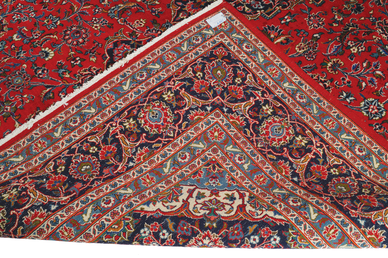 WEST PERSIAN KASHAN CARPET, CIRCA 1930 on red ground with central medallion and navy border 387 x - Image 5 of 6