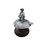 LEAD BIRD BATH surmounted by cherubs, raised on a stone base Worldwide shipping available. Contact