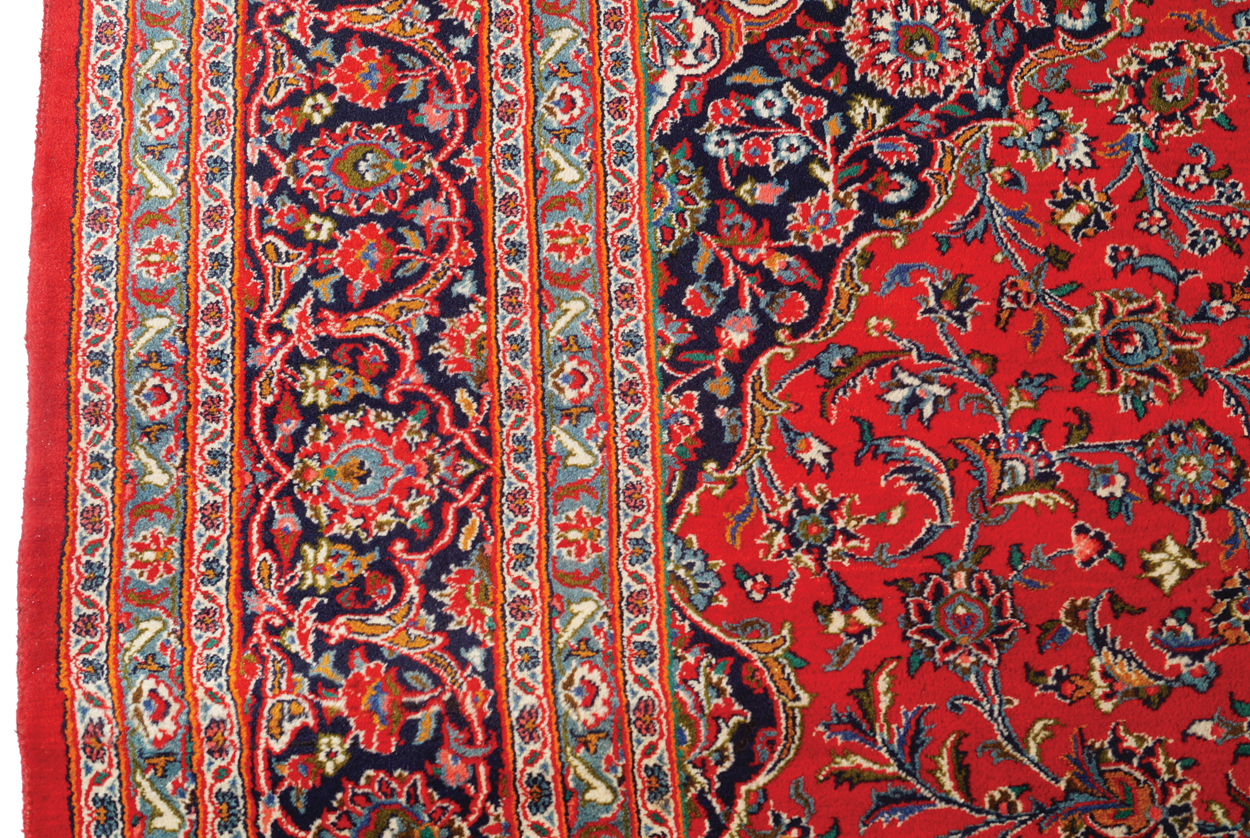 WEST PERSIAN KASHAN CARPET, CIRCA 1930 on red ground with central medallion and navy border 387 x - Image 3 of 6