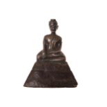 NINETEENTH-CENTURY SILVER BUDDHA seated, raised on a composite base 15 cm. high; 11 cm. wide