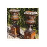 PAIR OF LARGE NINETEENTH-CENTURY CAMPANA SHAPED TERRACOTTA URNS each with raised moulded leaf