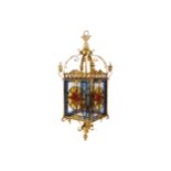 LARGE BRASS AND LEADED GLASS HALL LANTERN with paterae panels suspended on scroll arms 115 cm. high;
