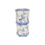 NINETEENTH-CENTURY JAPANESE BLUE AND WHITE STICK STAND of hexagonal form, draped with bunches of