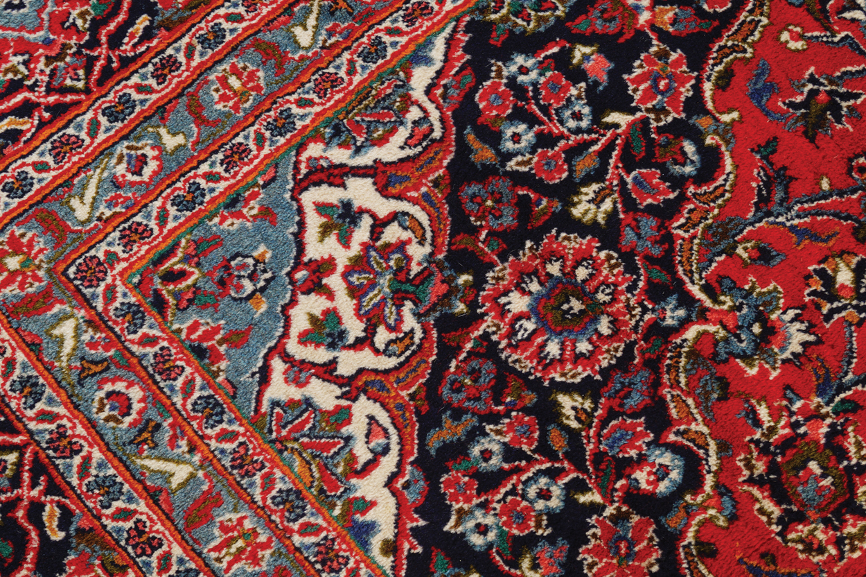 WEST PERSIAN KASHAN CARPET, CIRCA 1930 on red ground with central medallion and navy border 387 x - Image 6 of 6