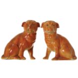 PAIR OF NINETEENTH-CENTURY DELPH PUPS each seated on its hind legs 20 cm. high; 15 cm. wide (2)