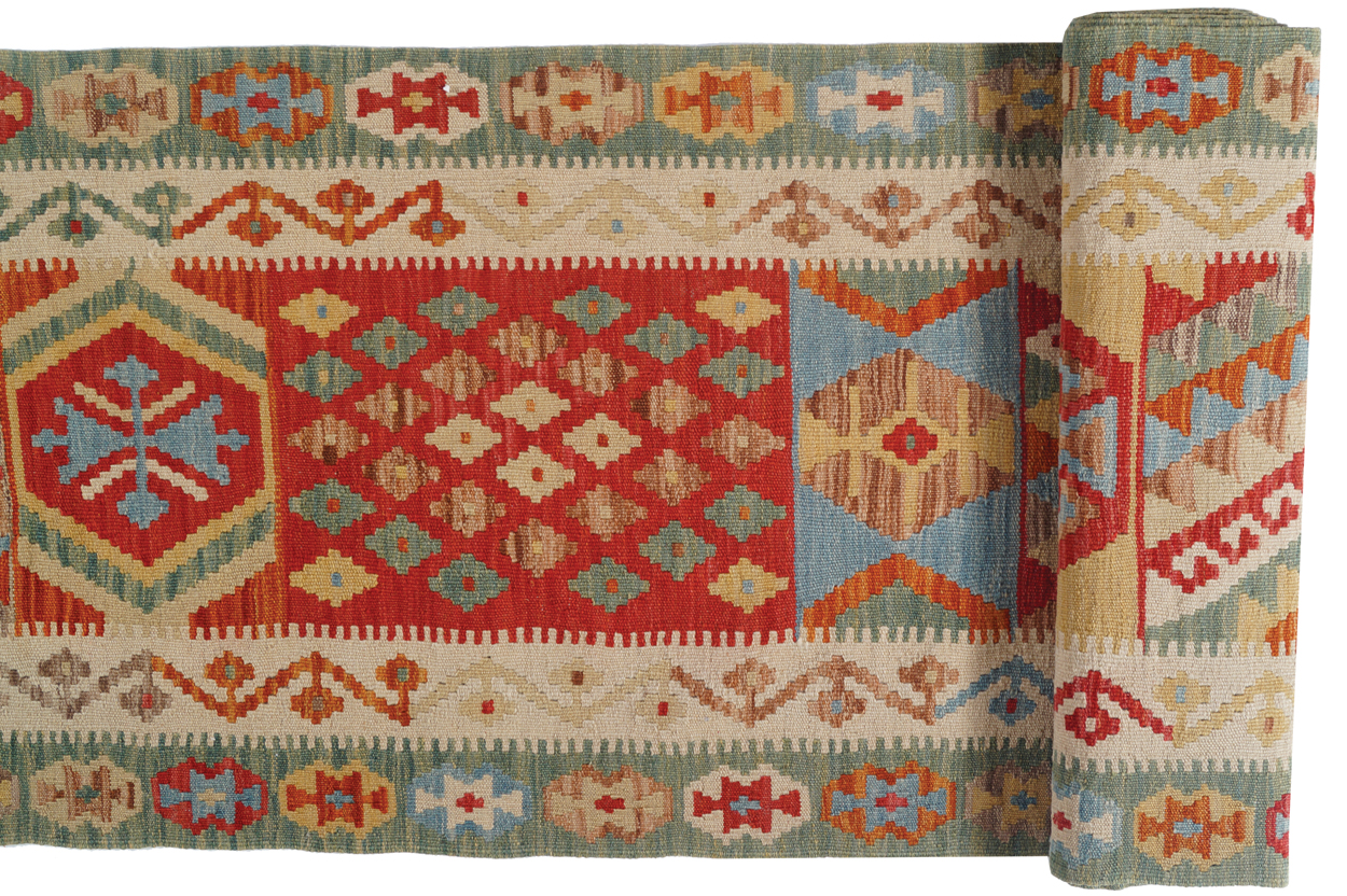 NORTHEAST PERSIAN RUNNER with outer pistachio border and twelve medallions; veg dye 496 x 75 cm. - Image 3 of 6