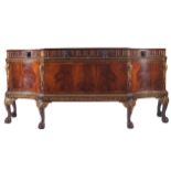 LATE NINETEENTH-CENTURY DUBLIN MAHOGANY AND PARCEL-GILT SIDEBOARD the serpentine shaped top above